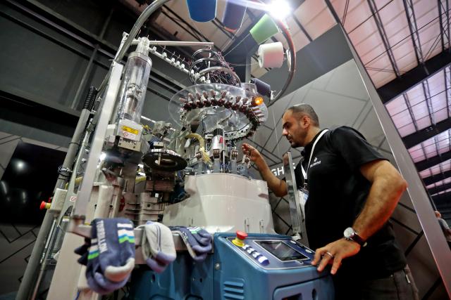 (251030) -- BEIRUT, Oct. 30, 2025 (Xinhua) -- This photo taken on Oct. 29, 2025 shows an exhibitor showcasing textile craftsmanship at the Lebanese Industry Expo 2025 in Beirut, Lebanon. The expo, which takes place in Beirut from Oct. 29 to Nov. 1, aims to bring together leaders, innovators, and stakeholders from across Lebanon's industrial sector to showcase products, exchange ideas, and explore new opportunities. (Xinhua/Bilal Jawich)