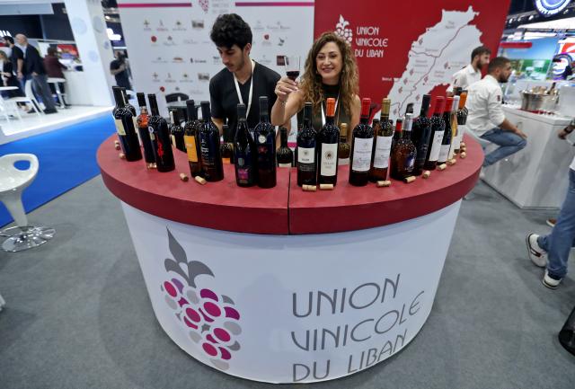 (251030) -- BEIRUT, Oct. 30, 2025 (Xinhua) -- This photo taken on Oct. 29, 2025 shows an exhibitor displaying Lebanese products at the Lebanese Industry Expo 2025 in Beirut, Lebanon. The expo, which takes place in Beirut from Oct. 29 to Nov. 1, aims to bring together leaders, innovators, and stakeholders from across Lebanon's industrial sector to showcase products, exchange ideas, and explore new opportunities. (Xinhua/Bilal Jawich)