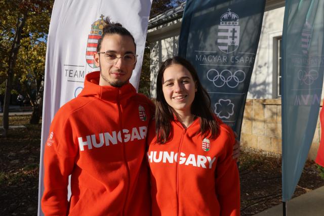 (251030) -- BUDAPEST, Oct. 30, 2025 (Xinhua) -- Hungarian curling mixed doubles pair Raul Karasz (L) and Linda Joo pose at a press conference organised by Hungarian Olympic Committee to celebrate the 100-day countdown to the opening of the Milano-Cortina 2026 Olympic Winter Games in Budapest, Hungary on Oct. 29, 2025. TO GO WITH "Hungary eyeing short track speed skating glory at 2026 Winter Olympics" (Photo by Attila Volgyi/Xinhua)