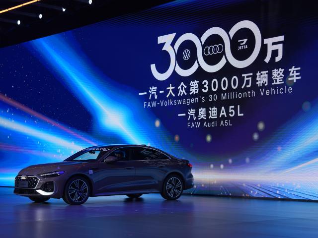 (251030) -- CHANGCHUN, Oct. 30, 2025 (Xinhua) -- The 30 millionth car manufactured by FAW-Volkswagen is pictured at an offline ceremony in Changchun, northeast China's Jilin Province, Oct. 30, 2025. The offline ceremony celebrating the 30 millionth car rolling off the FAW-Volkswagen production line was held here on Thursday. (Xinhua/Zhang Nan)