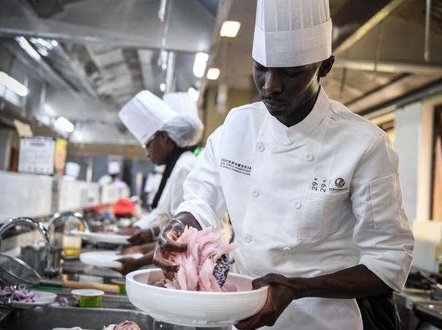 (251030) -- NAIROBI, Oct. 30, 2025 (Xinhua) -- A contestant prepares ingredients during the 2025 Africa Championship of Chinese Cuisine held in Nairobi, Kenya, Oct. 30, 2025. The 2025 Africa Championship of Chinese Cuisine, the first of its kind on the continent, was held Thursday in the Kenyan capital Nairobi, highlighting the deepening cultural exchanges between China and Kenya. (Xinhua/Li Yahui)