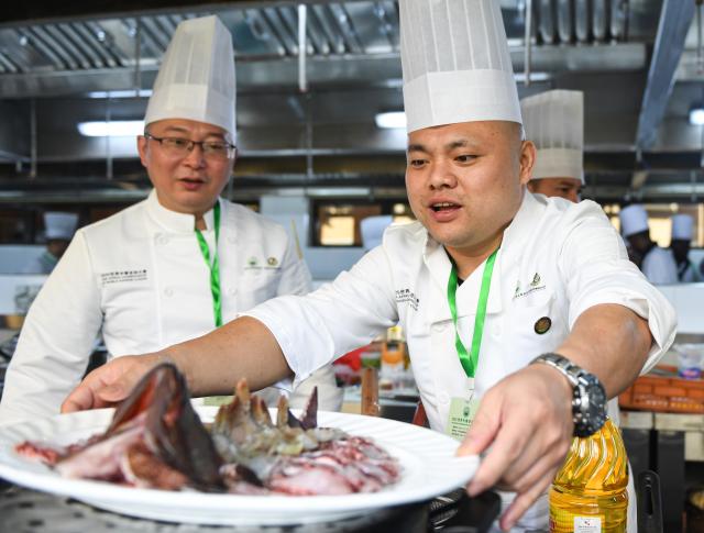 (251030) -- NAIROBI, Oct. 30, 2025 (Xinhua) -- A contestant prepares ingredients during the 2025 Africa Championship of Chinese Cuisine held in Nairobi, Kenya, Oct. 30, 2025. The 2025 Africa Championship of Chinese Cuisine, the first of its kind on the continent, was held Thursday in the Kenyan capital Nairobi, highlighting the deepening cultural exchanges between China and Kenya. (Xinhua/Li Yahui)
