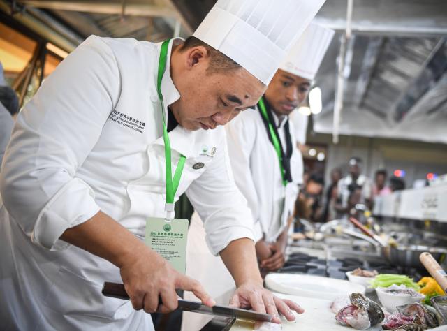 (251030) -- NAIROBI, Oct. 30, 2025 (Xinhua) -- A contestant prepares ingredients during the 2025 Africa Championship of Chinese Cuisine held in Nairobi, Kenya, Oct. 30, 2025. The 2025 Africa Championship of Chinese Cuisine, the first of its kind on the continent, was held Thursday in the Kenyan capital Nairobi, highlighting the deepening cultural exchanges between China and Kenya. (Xinhua/Li Yahui)