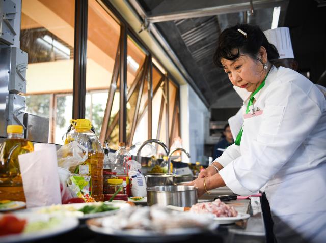 (251030) -- NAIROBI, Oct. 30, 2025 (Xinhua) -- A contestant prepares ingredients during the 2025 Africa Championship of Chinese Cuisine held in Nairobi, Kenya, Oct. 30, 2025. The 2025 Africa Championship of Chinese Cuisine, the first of its kind on the continent, was held Thursday in the Kenyan capital Nairobi, highlighting the deepening cultural exchanges between China and Kenya. (Xinhua/Li Yahui)