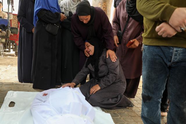 (251030) -- GAZA, Oct. 30, 2025 (Xinhua) -- Palestinians mourn over victims killed during Israeli airstrikes, at al-Shifa hospital in west of Gaza City, Oct. 29, 2025. At least 100 Palestinians were killed in Israeli attacks across the Gaza Strip from late Tuesday to Wednesday, marking the most intense escalation since the ceasefire agreement took effect on October 10. (Photo by Rizek Abdeljawad/Xinhua)