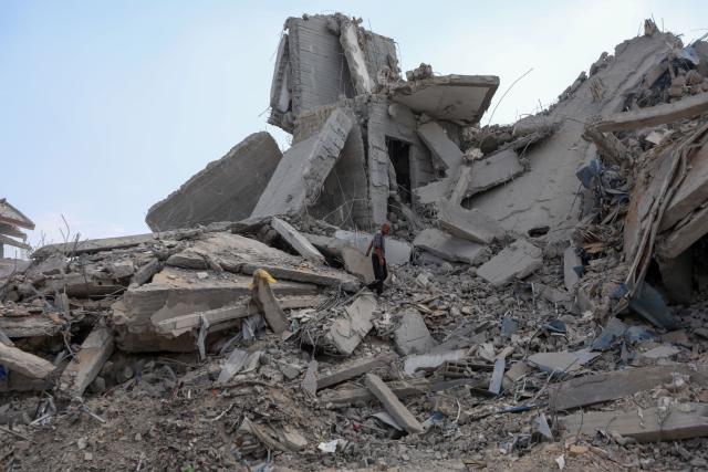 (251030) -- GAZA, Oct. 30, 2025 (Xinhua) -- A Palestinian inspects destroyed houses after Israeli airstrikes, in west of Gaza City, Oct. 29, 2025. At least 100 Palestinians were killed in Israeli attacks across the Gaza Strip from late Tuesday to Wednesday, marking the most intense escalation since the ceasefire agreement took effect on October 10. (Photo by Rizek Abdeljawad/Xinhua)