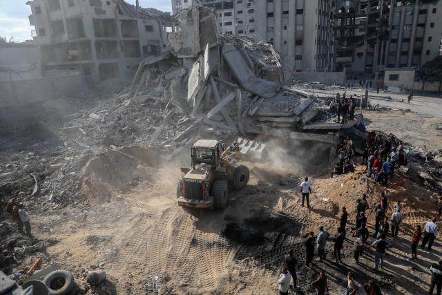 (251030) -- GAZA, Oct. 30, 2025 (Xinhua) -- Palestinians inspect destroyed houses after Israeli airstrikes, in west of Gaza City, Oct. 29, 2025. At least 100 Palestinians were killed in Israeli attacks across the Gaza Strip from late Tuesday to Wednesday, marking the most intense escalation since the ceasefire agreement took effect on October 10. (Photo by Rizek Abdeljawad/Xinhua)