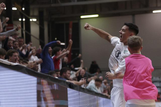 (251031) -- LJUBLJANA, Oct. 31, 2025 (Xinhua) -- Gasper Trdin (L) of Vrhnika celebrates during the UEFA Futsal Champions League Main Round Group 8 match between Vrhnika of Slovenia and Forca of North Macedonia in Ljubljana, Slovenia, Oct. 30, 2025. (Photo by Zeljko Stevanic/Xinhua)