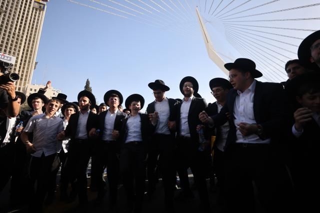 (251031) -- JERUSALEM, Oct. 31, 2025 (Xinhua) -- Ultra-Orthodox Jews take part in a protest in Jerusalem on Oct. 30, 2025. Hundreds of thousands of ultra-Orthodox Jews filled the streets of Jerusalem on Thursday to protest government plans to expand military conscription in their community and the recent arrests of draft dodgers by military police. (Photo by Jamal Awad/Xinhua)