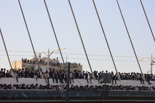 (251031) -- JERUSALEM, Oct. 31, 2025 (Xinhua) -- Ultra-Orthodox Jews take part in a protest in Jerusalem on Oct. 30, 2025. Hundreds of thousands of ultra-Orthodox Jews filled the streets of Jerusalem on Thursday to protest government plans to expand military conscription in their community and the recent arrests of draft dodgers by military police. (Photo by Gil Cohen Magen/Xinhua)