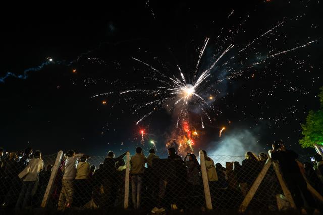 (251031) -- TAUNGGYI, Oct. 31, 2025 (Xinhua) -- Fireworks explode in the sky during the Taunggyi Hot-Air Balloon Festival in Taunggyi, Shan state, Myanmar, Oct. 30, 2025. TO GO WITH "Feature: Myanmar's hot-air balloon festival blends heritage, unity with joy" (Xinhua/Myo Kyaw Soe)