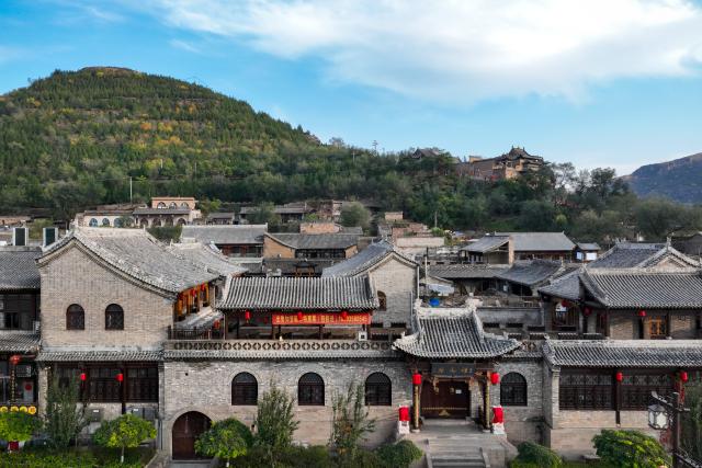 (251031) -- TAIYUAN, Oct. 31, 2025 (Xinhua) -- An aerial drone photo taken on Oct. 29, 2025 shows a view of the Qikou ancient town in Linxian County, north China's Shanxi Province. Qikou, an ancient town along the Yellow River, was an important trade ferry in history, where merchants unloaded goods such as fur, wool and herbs from boats coming upriver and switched to land transportation to further deliver them to cites like Taiyuan, Beijing, and Tianjin. Such a geographical advantage made Qikou an important port until the 1970s.
   However, Qikou's glory gradually faded in the following decades as land transportation network improved along the Yellow River area.
   In recent years, local government has been making efforts to renovate and protect the historical buildings and ancient residences here, promoting the integrated development of culture and tourism. (Xinhua/Zhan Yan)