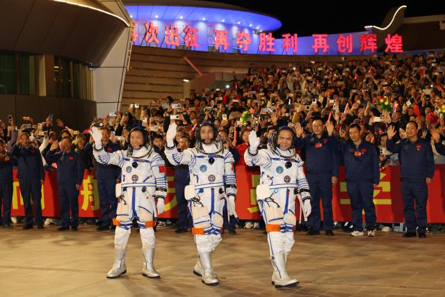 (251031) -- JIUQUAN, Oct. 31, 2025 (Xinhua) -- Chinese astronauts Zhang Lu (R), Wu Fei (C) and Zhang Hongzhang attend a send-off ceremony at the Jiuquan Satellite Launch Center in northwest China on Oct. 31, 2025. A send-off ceremony for the three Chinese astronauts of the Shenzhou-21 crewed space mission was held Friday at the Jiuquan Satellite Launch Center in northwest China, according to the China Manned Space Agency. (Photo by Wang Jiangbo/Xinhua)