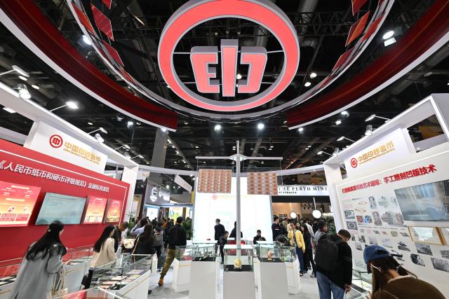 (251101) -- BEIJING, Nov. 1, 2025 (Xinhua) -- People visit the booth of China Banknote Printing and Minting during the Beijing International Coin Exposition 2025 at the China National Convention Center in Beijing, capital of China, Oct. 31, 2025. (Xinhua/Li Xin)