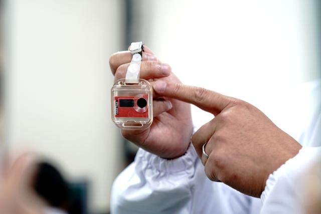 (251101) -- SHANGHAI, Nov. 1, 2025 (Xinhua) -- A staff member introduces a device which can measure the radiation level to ensure personal safety at the Wuwei campus of the Chinese Academy of Sciences' Shanghai Institute of Applied Physics (SINAP) in Minqin County of Wuwei City, northwest China's Gansu Province, Oct. 24, 2025. China has successfully achieved the first-ever thorium to uranium nuclear fuel conversion in a Thorium Molten Salt Reactor (TMSR), and obtained valid experimental data following thorium fuel loading, confirming the technical feasibility of thorium utilization in a molten-salt reactor nuclear energy system, according to the Chinese Academy of Sciences' Shanghai Institute of Applied Physics (SINAP) on Saturday. 
   TO GO WITH "China achieves thorium-uranium nuclear fuel conversion in molten-salt reactor" (Xinhua/Zhang Jiansong)