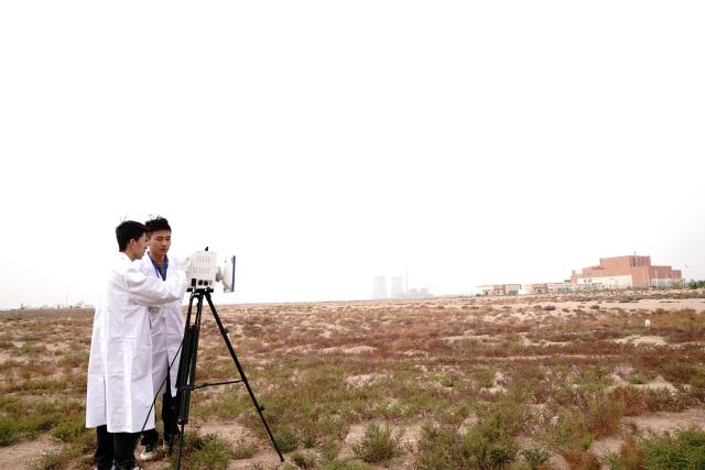 (251101) -- SHANGHAI, Nov. 1, 2025 (Xinhua) -- Researchers conduct aerosol sampling at the Wuwei campus of the Chinese Academy of Sciences' Shanghai Institute of Applied Physics (SINAP) in Minqin County of Wuwei City, northwest China's Gansu Province, Oct. 24, 2025. China has successfully achieved the first-ever thorium to uranium nuclear fuel conversion in a Thorium Molten Salt Reactor (TMSR), and obtained valid experimental data following thorium fuel loading, confirming the technical feasibility of thorium utilization in a molten-salt reactor nuclear energy system, according to the Chinese Academy of Sciences' Shanghai Institute of Applied Physics (SINAP) on Saturday. 
   TO GO WITH "China achieves thorium-uranium nuclear fuel conversion in molten-salt reactor" (Xinhua/Zhang Jiansong)