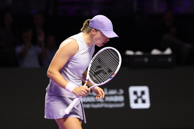 (251102) -- RIYADH, Nov. 2, 2025 (Xinhua) -- Iga Swiatek of Poland celebrates scoring during the women's singles round robin match against Madison Keys of the United States at the WTA Finals tennis tournament in Riyadh, Saudi Arabia, Nov. 1, 2025. (Xinhua/Luo Chen)