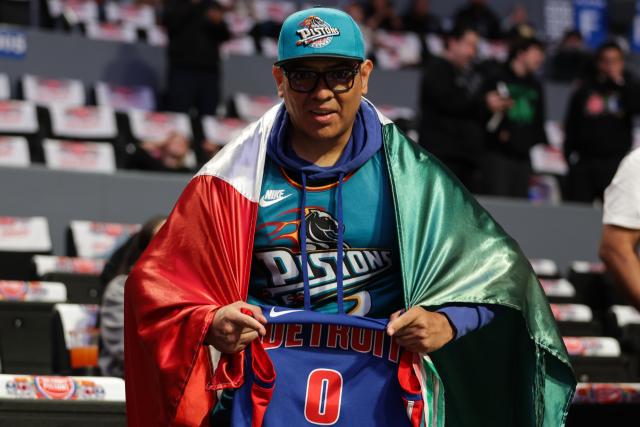 (251102) -- MEXICO CITY, Nov. 2, 2025 (Xinhua) -- A supporter of Detroit Pistons cheers for the team before the 2025-2026 NBA regular season match between Detroit Pistons and Dallas Mavericks in Mexico City, capital of Mexico, on Nov. 1, 2025. (Photo by Francisco Canedo/Xinhua)