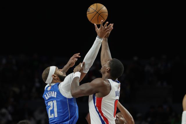 (251102) -- MEXICO CITY, Nov. 2, 2025 (Xinhua) -- Dallas Mavericks' Daniel Gafford (L) fights for a rebound during the 2025-2026 NBA regular season match between Detroit Pistons and Dallas Mavericks in Mexico City, capital of Mexico, on Nov. 1, 2025. (Photo by Francisco Canedo/Xinhua)