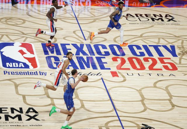 (251102) -- MEXICO CITY, Nov. 2, 2025 (Xinhua) -- Dallas Mavericks' Cooper Flagg (bottom) dribbles the ball during the 2025-2026 NBA regular season match between Detroit Pistons and Dallas Mavericks in Mexico City, capital of Mexico, on Nov. 1, 2025. (Photo by Francisco Canedo/Xinhua)