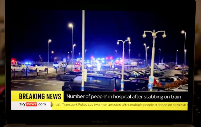 (251102) -- LONDON, Nov. 2, 2025 (Xinhua) -- A screen shows police cars on duty near a railway station in Huntingdon of Cambridgeshire, Britain, Nov. 2, 2025. Two people have been arrested after multiple people were stabbed on train in Britain, police said on Saturday.
   It remains unclear how many people have been stabbed or how serious the injuries are. (Xinhua/Li Ying)