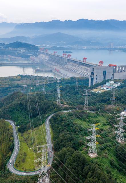 (251102) -- ZIGUI, Nov. 2, 2025 (Xinhua) -- An aerial drone photo taken on Nov. 2, 2025 shows the Three Gorges Dam and its outbound power transmission lines in Yichang, central China's Hubei Province. The Three Gorges project, the world's largest hydropower project, has generated over 423 billion kWh of electricity since it was officially certified as complete and fully functioning on Nov. 1, 2020. (Photo by Wang Gang/Xinhua)