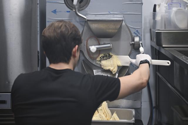 (251103) -- SHANGHAI, Nov. 3, 2025 (Xinhua) -- Alessandro Conti makes Italian-style ice cream at his gelato shop in Shanghai, east China, Sept. 30, 2025.
  At the Hengshan-Fuxing Roads (Hengfu) Historic Protection Zone in Shanghai's Xuhui District, there is a shop named Amuni Gelato, offering Italian-style ice cream. The owner of the gelato shop is Alessandro Conti.
  The connection between Conti and China began during his student years. He studied Chinese at the University of Palermo and later went to Chongqing in southwest China as an exchange student. With a bachelor's degree in simultaneous interpretation, he is fluent in Italian, English, and Chinese. 
  "I've lived in many cities in China, but Shanghai is my favorite," Conti said. "It's international and diverse, and offers everyone the opportunity to express themselves." It is Conti's preference for Shanghai that motivated him to settle down in Shanghai and start his own business. 
  As an Italian food vlogger and entrepreneur based in Shanghai, Conti believes that Shanghai's openness and inclusiveness are catalysts for young entrepreneurs. 
  "Setting up a company here is convenient. From registration to the business license offering, the efficiency is remarkable," said Conti. "I want to build up my family and my future here." (Xinhua/Chen Haoming)
