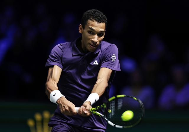 (251103) -- PARIS, Nov. 3, 2025 (Xinhua) -- Felix Auger-Aliassime hits a return during the final match between Jannik Sinner of Italy and Felix Auger-Aliassime of Canada at the Paris ATP Masters 1000 tennis tournament at Paris La Defense Arena in Paris, France, on Nov. 2, 2025. (Xinhua/Gao Jing)