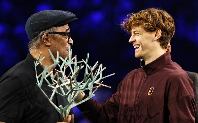 (251103) -- PARIS, Nov. 3, 2025 (Xinhua) -- Former French tennis player Yannick Noah (L) poses with Jannik Sinner during the reward presenting ceremony after the final match between Jannik Sinner of Italy and Felix Auger-Aliassime of Canada at the Paris ATP Masters 1000 tennis tournament at Paris La Defense Arena in Paris, France, on Nov. 2, 2025. (Xinhua/Gao Jing)
