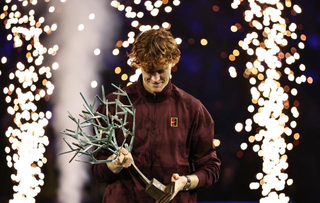 (251103) -- PARIS, Nov. 3, 2025 (Xinhua) -- Jannik Sinner looks at the trophy during the reward presenting ceremony after the final match between Jannik Sinner of Italy and Felix Auger-Aliassime of Canada at the Paris ATP Masters 1000 tennis tournament at Paris La Defense Arena in Paris, France, on Nov. 2, 2025. (Xinhua/Gao Jing)