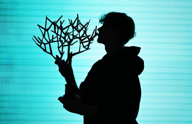 (251103) -- PARIS, Nov. 3, 2025 (Xinhua) -- Jannik Sinner poses with the trophy after the final match between Jannik Sinner of Italy and Felix Auger-Aliassime of Canada at the Paris ATP Masters 1000 tennis tournament at Paris La Defense Arena in Paris, France, on Nov. 2, 2025. (Xinhua/Gao Jing)