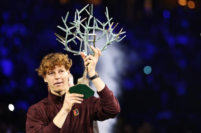 (251103) -- PARIS, Nov. 3, 2025 (Xinhua) -- Jannik Sinner pose with the trophy for photos during the reward presenting ceremony after the final match between Jannik Sinner of Italy and Felix Auger-Aliassime of Canada at the Paris ATP Masters 1000 tennis tournament at Paris La Defense Arena in Paris, France, on Nov. 2, 2025. (Xinhua/Gao Jing)