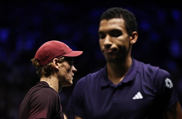 (251103) -- PARIS, Nov. 3, 2025 (Xinhua) -- Jannik Sinner (R) of Italy and Felix Auger-Aliassime of Canada react during their final match the final match between Jannik Sinner of Italy and Felix Auger-Aliassime of Canada at the Paris ATP Masters 1000 tennis tournament at Paris La Defense Arena in Paris, France, on Nov. 2, 2025. (Xinhua/Gao Jing)