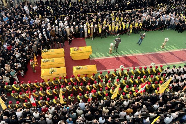 (251103) -- NABATIEH, Nov. 3, 2025 (Xinhua) -- This photo taken by a mobile phone on Nov. 2, 2025 shows people attending a funeral of the victims of Israeli airstrikes in Nabatieh, southern Lebanon.
  Hundreds of Hezbollah supporters on Sunday attended the funeral of five Hezbollah members killed in two Israeli airstrikes in Nabatieh. (Photo by Ali Hashisho/Xinhua)