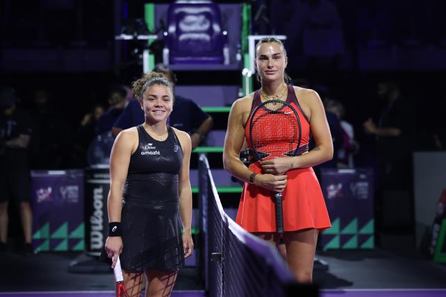 (251103) -- RIYADH, Nov. 3, 2025 (Xinhua) -- Jasmine Paolini (L) of Italy and Aryna Sabalenka of Belarus pose for photos before their round robin match at WTA Finals tennis tournament in Riyadh, Saudi Arabia, on Nov. 2, 2025. (Xinhua/Luo Chen)