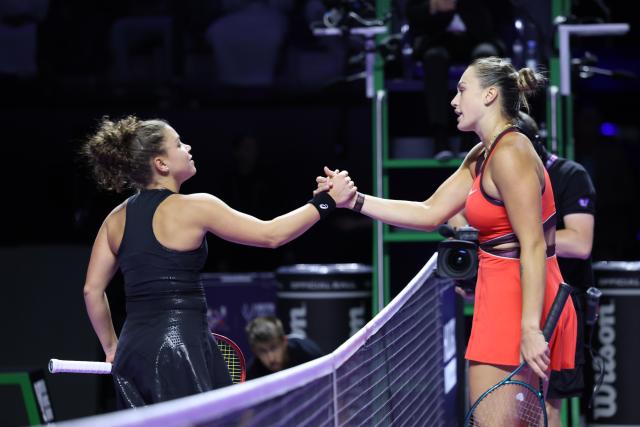 (251103) -- RIYADH, Nov. 3, 2025 (Xinhua) -- Jasmine Paolini (L) of Italy and Aryna Sabalenka of Belarus shake hands after their round robin match at WTA Finals tennis tournament in Riyadh, Saudi Arabia, on Nov. 2, 2025. (Xinhua/Luo Chen)