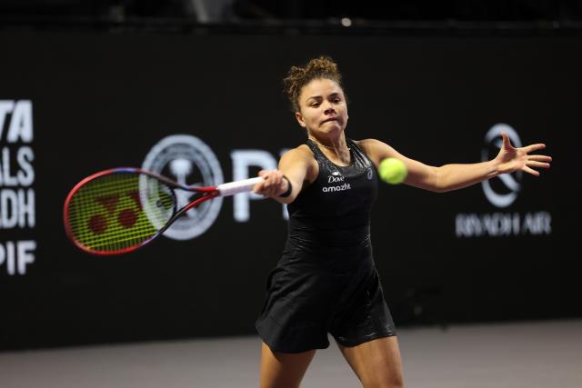 (251103) -- RIYADH, Nov. 3, 2025 (Xinhua) -- Jasmine Paolini of Italy returns a ball during the round robin match against Aryna Sabalenka of Belarus at WTA Finals tennis tournament in Riyadh, Saudi Arabia, on Nov. 2, 2025. (Xinhua/Luo Chen)