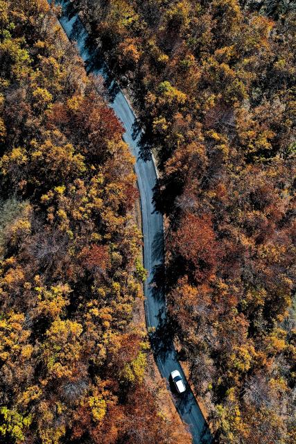 (251103) -- SKOPJE, Nov. 3, 2025 (Xinhua) -- An aerial drone photo shows a car running on a road at Skopska Crna Gora, some 35 km from the capital of Skopje in North Macedonia, on Nov. 2, 2025. (Photo by Tomislav Georgiev/Xinhua)
