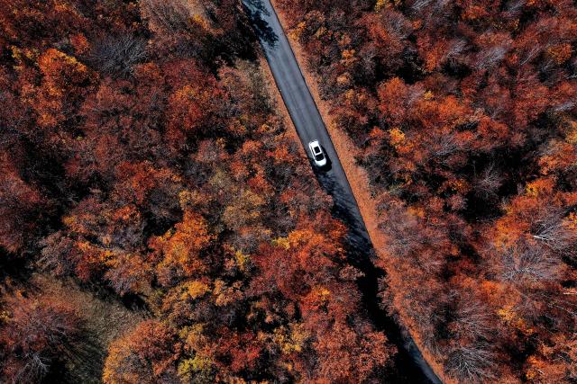 (251103) -- SKOPJE, Nov. 3, 2025 (Xinhua) -- An aerial drone photo shows a car running on a road at Skopska Crna Gora, some 35 km from the capital of Skopje in North Macedonia, on Nov. 2, 2025. (Photo by Tomislav Georgiev/Xinhua)