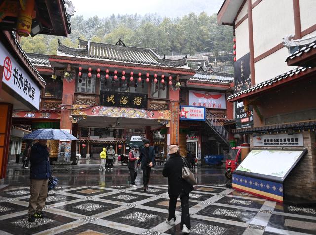 (251103) -- GANZI, Nov. 3, 2025 (Xinhua) -- People visit a scenic spot in Kangding City, Ganzi Tibetan Autonomous Prefecture, southwest China's Sichuan Province, Nov. 1, 2025. In recent years, Ganzi Tibetan Autonomous Prefecture has leveraged its natural scenic advantages to develop its cultural and tourism industry. From January to October this year, the prefecture has received over 40 million tourist trips, setting a new record for the same period. (Xinhua/Xiao Xiao)