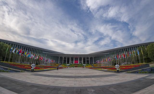 (251103) -- SHANGHAI, Nov. 3, 2025 (Xinhua) -- This photo taken on Nov. 3, 2025 shows the south square of the National Exhibition and Convention Center (Shanghai), the main venue for the eighth China International Import Expo (CIIE), in east China's Shanghai. The eighth CIIE will be held in Shanghai from Nov. 5 to 10. The event this year will feature 4,108 overseas exhibitors from 155 countries, regions and international organizations, with the total exhibition area exceeding 430,000 square meters, setting a new record in scale. (Xinhua/Fang Zhe)