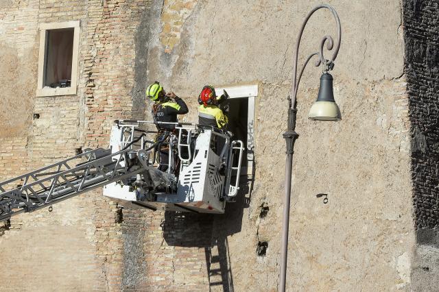 (251103) -- ROME, Nov. 3, 2025 (Xinhua) -- Firefighters work on the site after a section of the Torre dei Conti, a medieval tower undergoing restoration in central Rome, Italy, Nov. 3, 2025. A section of the Torre dei Conti collapsed on Monday, injuring four construction workers and prompting an emergency rescue operation, local media reported. (Photo by Alberto Lingria/Xinhua)