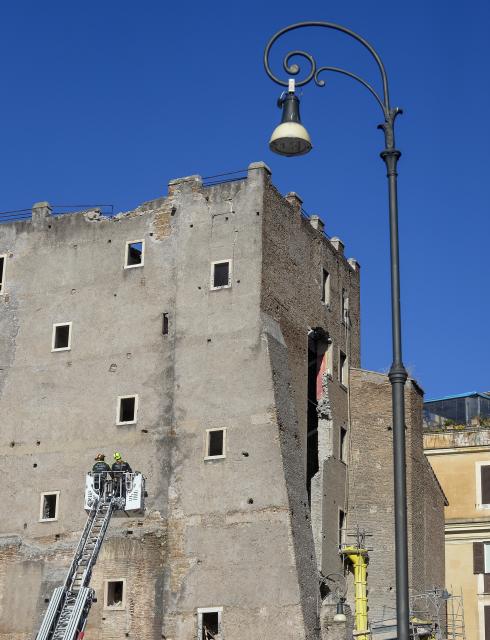 (251103) -- ROME, Nov. 3, 2025 (Xinhua) -- Firefighters work on the site after a section of the Torre dei Conti, a medieval tower undergoing restoration in central Rome, Italy, Nov. 3, 2025. A section of the Torre dei Conti collapsed on Monday, injuring four construction workers and prompting an emergency rescue operation, local media reported. (Photo by Alberto Lingria/Xinhua)