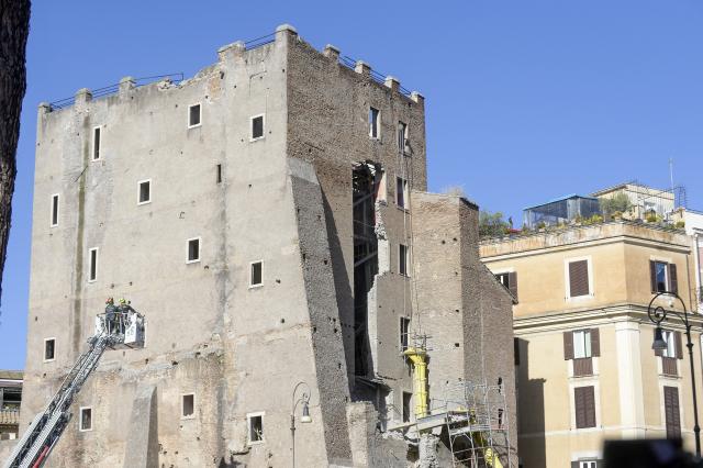 (251103) -- ROME, Nov. 3, 2025 (Xinhua) -- Firefighters work on the site after a section of the Torre dei Conti, a medieval tower undergoing restoration in central Rome, Italy, Nov. 3, 2025. A section of the Torre dei Conti collapsed on Monday, injuring four construction workers and prompting an emergency rescue operation, local media reported. (Photo by Alberto Lingria/Xinhua)