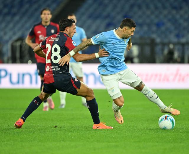 (251104) -- ROME, Nov. 4, 2025 (Xinhua) -- Lazio's Mattia Zaccagni (R) vies with Cagliari's Gabriele Zappa during a Serie A football match between Lazio and Cagliari in Rome, Italy, on Nov.3, 2025. (Photo by Alberto Lingria/Xinhua)