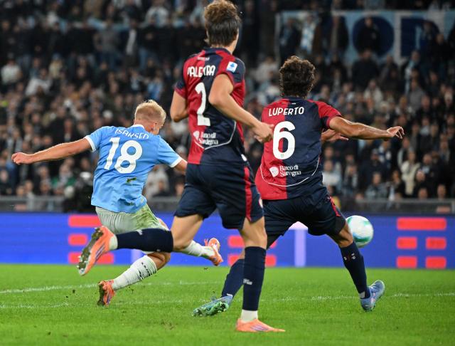 (251104) -- ROME, Nov. 4, 2025 (Xinhua) -- Lazio's Gustav Isaksen (L) scores during a Serie A football match between Lazio and Cagliari in Rome, Italy, on Nov.3, 2025. (Photo by Alberto Lingria/Xinhua)