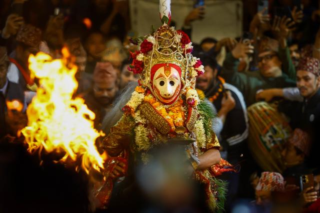 (251104) -- LALITPUR, Nov. 4, 2025 (Xinhua) -- A masked performer dances during the Kartik Naach festival at Patan Durbar Square in Lalitpur, Nepal, Nov. 4, 2025. (Photo by Sulav Shrestha/Xinhua)