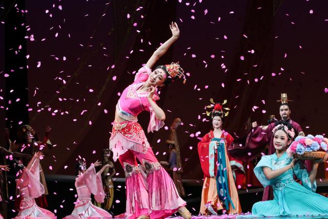 (251104) -- LANZHOU, Nov. 4, 2025 (Xinhua) -- The dance drama "Flower Rains Along Silk Road" is staged at the Dunhuang Theater in Dunhuang, northwest China's Gansu Province, Sept. 20, 2025.
  Dunhuang dance refers to a dance style that aims to bring to life the iconic figures depicted on the ancient murals of the Mogao Grottoes, which is a 1,600-year-old UNESCO World Heritage site in Dunhuang.
  Drawing on historical themes, contemporary artists have created four awe-inspiring music and dance masterpieces, which include the classic dance drama "Flower Rains Along Silk Road," whose footprints have covered more than 40 countries and regions since its debut in 1979, and "the Thousand-Hand Bodhisattva" performed by dancers with hearing or visual impairment.
  Last year, the four classic performing arts attracted more than 1.14 million visitors to Dunhuang, with a record of over 2,000 performances, according to data from the cultural and tourism department of Gansu Province. Through these cultural and visual feasts, tourists are immersed in the history of the ancient Silk Road, carrying forward Dunhuang's ongoing journey of cultural preservation.
  The introduction of Dunhuang dance to local educational institutions also fuels the boom. The unique dance genre has been passed down among young generations, promoting it to a wider audience so that more people will learn about the beauty of Dunhuang. (Xinhua/Lang Bingbing)