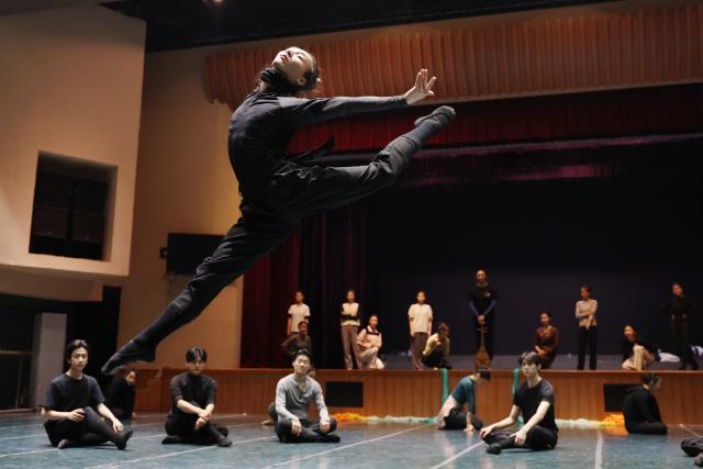 (251104) -- LANZHOU, Nov. 4, 2025 (Xinhua) -- A dancer rehearses the dance drama "Flower Rains Along Silk Road" in Lanzhou, northwest China's Gansu Province, Nov. 3, 2025.
  Dunhuang dance refers to a dance style that aims to bring to life the iconic figures depicted on the ancient murals of the Mogao Grottoes, which is a 1,600-year-old UNESCO World Heritage site in Dunhuang.
  Drawing on historical themes, contemporary artists have created four awe-inspiring music and dance masterpieces, which include the classic dance drama "Flower Rains Along Silk Road," whose footprints have covered more than 40 countries and regions since its debut in 1979, and "the Thousand-Hand Bodhisattva" performed by dancers with hearing or visual impairment.
  Last year, the four classic performing arts attracted more than 1.14 million visitors to Dunhuang, with a record of over 2,000 performances, according to data from the cultural and tourism department of Gansu Province. Through these cultural and visual feasts, tourists are immersed in the history of the ancient Silk Road, carrying forward Dunhuang's ongoing journey of cultural preservation.
  The introduction of Dunhuang dance to local educational institutions also fuels the boom. The unique dance genre has been passed down among young generations, promoting it to a wider audience so that more people will learn about the beauty of Dunhuang. (Xinhua/Chen Bin)