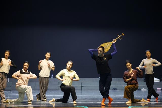(251104) -- LANZHOU, Nov. 4, 2025 (Xinhua) -- Dancers rehearse the dance drama "Flower Rains Along Silk Road" in Lanzhou, northwest China's Gansu Province, Nov. 3, 2025.
  Dunhuang dance refers to a dance style that aims to bring to life the iconic figures depicted on the ancient murals of the Mogao Grottoes, which is a 1,600-year-old UNESCO World Heritage site in Dunhuang.
  Drawing on historical themes, contemporary artists have created four awe-inspiring music and dance masterpieces, which include the classic dance drama "Flower Rains Along Silk Road," whose footprints have covered more than 40 countries and regions since its debut in 1979, and "the Thousand-Hand Bodhisattva" performed by dancers with hearing or visual impairment.
  Last year, the four classic performing arts attracted more than 1.14 million visitors to Dunhuang, with a record of over 2,000 performances, according to data from the cultural and tourism department of Gansu Province. Through these cultural and visual feasts, tourists are immersed in the history of the ancient Silk Road, carrying forward Dunhuang's ongoing journey of cultural preservation.
  The introduction of Dunhuang dance to local educational institutions also fuels the boom. The unique dance genre has been passed down among young generations, promoting it to a wider audience so that more people will learn about the beauty of Dunhuang. (Xinhua/Chen Bin)